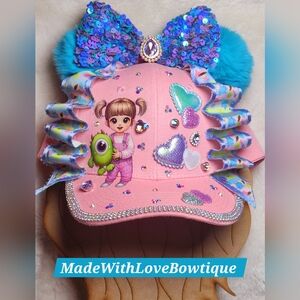 Pink and Blue Whimsical Hat with Pom-Poms